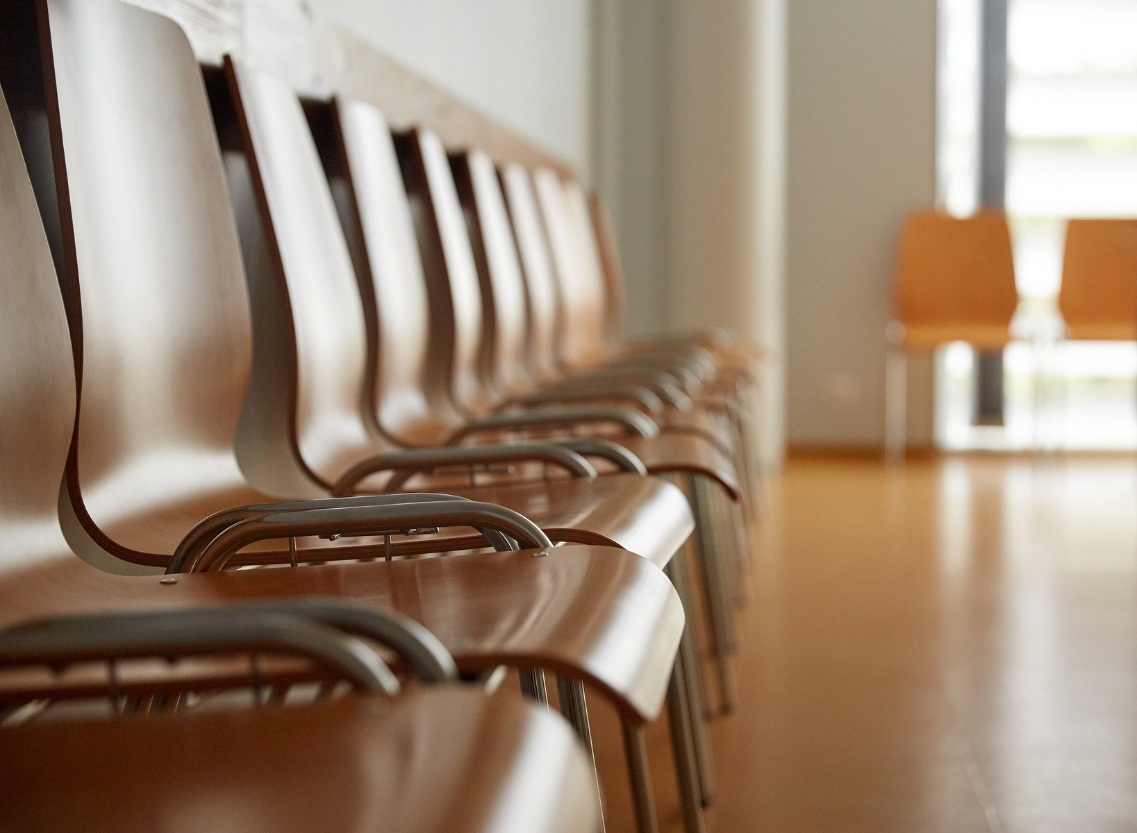 wooden-chairs-at-hospital-waiting-room