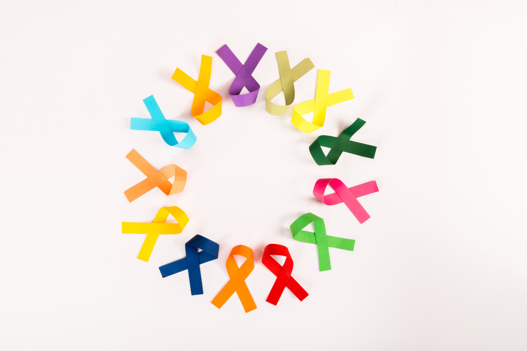 top-view-of-colorful-ribbons-arranged-in-circle-isolated-on-white-world-cancer-day-concept